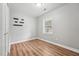 Bright bedroom with hardwood floors and natural light streaming through the window at 508 Solar Dr, Raleigh, NC 27610