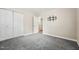 A neutral bedroom with closet, carpet flooring, and wall-mounted TV bracket ready for entertainment at 508 Solar Dr, Raleigh, NC 27610