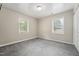 A cozy bedroom features plush carpet, natural light, and neutral colored walls at 508 Solar Dr, Raleigh, NC 27610