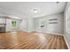Open-concept space with wood floors, access to the kitchen, and neutral paint throughout at 508 Solar Dr, Raleigh, NC 27610