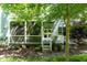 View of the rear of the property with backyard and screen porch at 511 Hillsborough St # 103, Chapel Hill, NC 27514