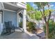 Relaxing porch area with comfortable seating and stylish pergola covered stairwell at 511 Hillsborough St # 103, Chapel Hill, NC 27514
