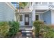 Inviting front porch with cozy seating area and well-maintained landscaping at entrance at 511 Hillsborough St # 103, Chapel Hill, NC 27514