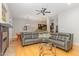 Spacious living room with a fireplace, modern lighting, and an open concept layout with an eat-in kitchen at 511 Hillsborough St # 103, Chapel Hill, NC 27514