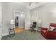 Comfortable living space featuring neutral walls, ceiling fan, and a doorway that provides natural light at 511 Hillsborough St # 103, Chapel Hill, NC 27514