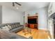 Comfortable living room with hardwood flooring, fireplace, and a large television at 511 Hillsborough St # 103, Chapel Hill, NC 27514