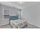 Bright bedroom with large windows, neutral walls, and carpet floors, creating a peaceful and relaxing atmosphere at 512 Flip Trl, Cary, NC 27513