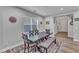 Bright dining area with dark wood table, bench seating, and a decorative area rug at 512 Flip Trl, Cary, NC 27513