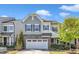 Charming two-story home with a stone accent, neutral colors and a two car garage at 512 Flip Trl, Cary, NC 27513