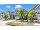 Charming two-story house featuring a mix of stone and siding, surrounded by manicured landscaping and a driveway at 512 Flip Trl, Cary, NC 27513