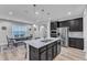 Eat in kitchen includes granite island and stainless appliances, and an adjacent dining area at 512 Flip Trl, Cary, NC 27513