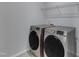 Convenient laundry area with side by side washer and dryer and shelving at 512 Flip Trl, Cary, NC 27513