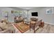 Cozy living room with plush sofas, wooden furnishings, and bright windows, offering a relaxing space at 512 Flip Trl, Cary, NC 27513