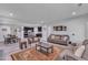 Open-concept living room and dining area with modern decor and ample seating options at 512 Flip Trl, Cary, NC 27513