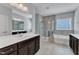 Luxurious main bathroom featuring a double sink vanity, a shower, and a soaking tub at 512 Flip Trl, Cary, NC 27513
