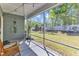 Relaxing screened porch with views of the backyard, ideal for enjoying the outdoors in comfort at 512 Flip Trl, Cary, NC 27513