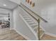 Bright and airy staircase with wooden handrails and white trim at 512 Flip Trl, Cary, NC 27513