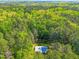 Aerial view of the property and house surrounded by a thick forest at 5204 William And Mary, Raleigh, NC 27616