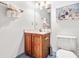 Bathroom featuring a vanity, a toilet, and decor at 5204 William And Mary, Raleigh, NC 27616