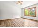 Bedroom featuring laminate flooring, natural light, and a ceiling fan at 5204 William And Mary, Raleigh, NC 27616