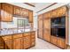 Well-equipped kitchen with wood cabinets, granite countertops, and modern appliances at 5204 William And Mary, Raleigh, NC 27616