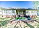 Inviting backyard featuring a covered porch, patio area, and well-manicured lawn, perfect for outdoor gatherings at 524 Auguston Ct, Sanford, NC 27330