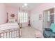 Charming pink bedroom with a four-poster bed, neutral carpet and white shutters at 524 Auguston Ct, Sanford, NC 27330