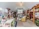 Large bonus room with sloped ceilings, a variety of shelving, and natural light from a window at 524 Auguston Ct, Sanford, NC 27330