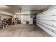 Spacious garage with ample storage, featuring a clean and organized layout with bright lighting at 524 Auguston Ct, Sanford, NC 27330