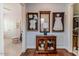 Hallway with wood floors, cabinet, and framed art at 524 Auguston Ct, Sanford, NC 27330