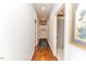 Hallway with wood flooring, blue walls, recessed lighting and doorway view to a bathroom at 524 Auguston Ct, Sanford, NC 27330