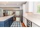 Open concept kitchen with stainless steel appliances, an island with bar seating, and stylish finishes at 524 Auguston Ct, Sanford, NC 27330