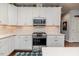 Modern kitchen features white cabinets, stainless steel appliances, and stylish finishes at 524 Auguston Ct, Sanford, NC 27330