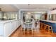Bright kitchen featuring white cabinets, stainless appliances, breakfast nook and hardwood flooring at 524 Auguston Ct, Sanford, NC 27330