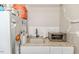 Functional kitchenette with a stainless steel refrigerator, sink, and toaster oven on a granite countertop at 524 Auguston Ct, Sanford, NC 27330
