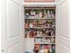 Walk-in pantry with stocked shelves at 524 Auguston Ct, Sanford, NC 27330
