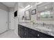 Elegant bathroom with double vanity, granite countertop, and decorative mirrors at 524 Birdsong Ln, Hurdle Mills, NC 27541