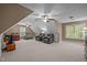 Spacious carpeted bonus room, two ceiling fans, and multiple windows at 524 Birdsong Ln, Hurdle Mills, NC 27541