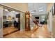 Elegant foyer with hardwood floors, staircase, and view of the office and living room at 524 Birdsong Ln, Hurdle Mills, NC 27541