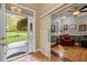 Inviting foyer with open doorway to office and view of landscaped front yard at 524 Birdsong Ln, Hurdle Mills, NC 27541