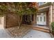 Welcoming front entrance with double doors, seating area, and beautiful landscaping at 524 Birdsong Ln, Hurdle Mills, NC 27541