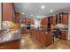 Spacious kitchen with stainless appliances, granite counters, dark cabinets, and hardwood floors at 524 Birdsong Ln, Hurdle Mills, NC 27541