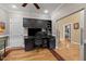 Bright home office with built-in shelving, desk, and view to the main bedroom at 524 Birdsong Ln, Hurdle Mills, NC 27541