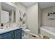 Bathroom features double vanity, white tub, and neutral paint at 580 Greenbriar Farm Trl, Siler City, NC 27344
