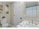 Modern bathroom with marble countertop, gold fixtures, and a stylish shower curtain at 580 Greenbriar Farm Trl, Siler City, NC 27344