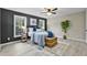 The bedroom features neutral paint, modern touches, vinyl floors and natural light at 580 Greenbriar Farm Trl, Siler City, NC 27344