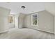 Bright bonus room featuring carpeted floors, and two windows offering natural light and outdoor views at 580 Greenbriar Farm Trl, Siler City, NC 27344