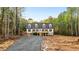 Spacious property with long drive surrounded by lush, mature trees and landscaping at 580 Greenbriar Farm Trl, Siler City, NC 27344