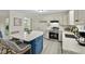Modern kitchen equipped with stainless steel appliances, white cabinets, and a center island at 580 Greenbriar Farm Trl, Siler City, NC 27344