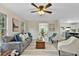 Inviting living room with neutral walls, plush seating, and open access to the kitchen and dining room at 580 Greenbriar Farm Trl, Siler City, NC 27344